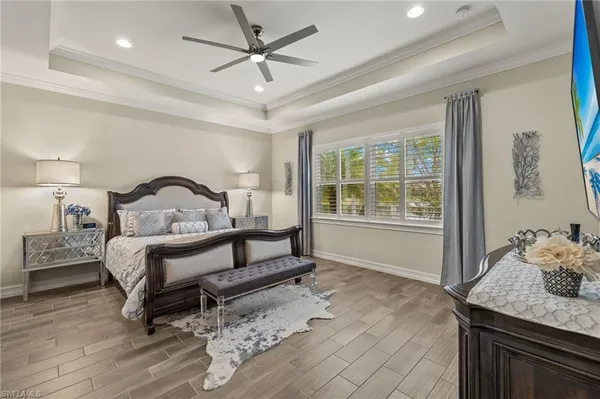 a bedroom with a bed a window and couch