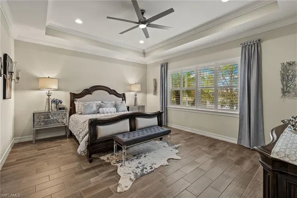 a bedroom with furniture and a window