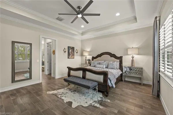 a bedroom with a bed and a mirror