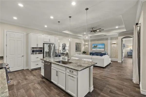 a kitchen with stainless steel appliances granite countertop a stove oven and a refrigerator