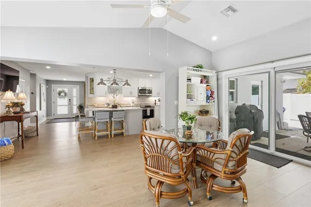 a dining room with furniture and window