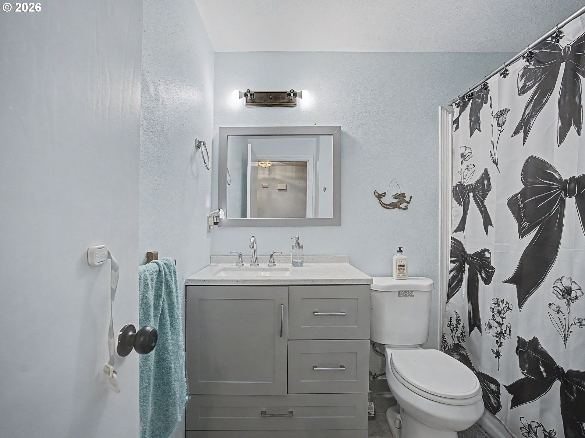 18015 Davis Street Sandy, OR 97055 - Photo 23 of 40 a bathroom with a toilet sink and mirror