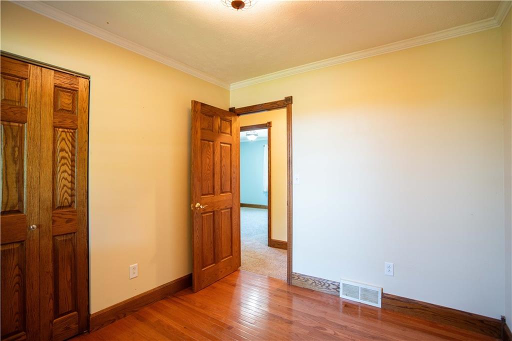 103 Mowry Road Monaca, PA 15061 - Photo 15 of 38 a view of an empty room with wooden floor