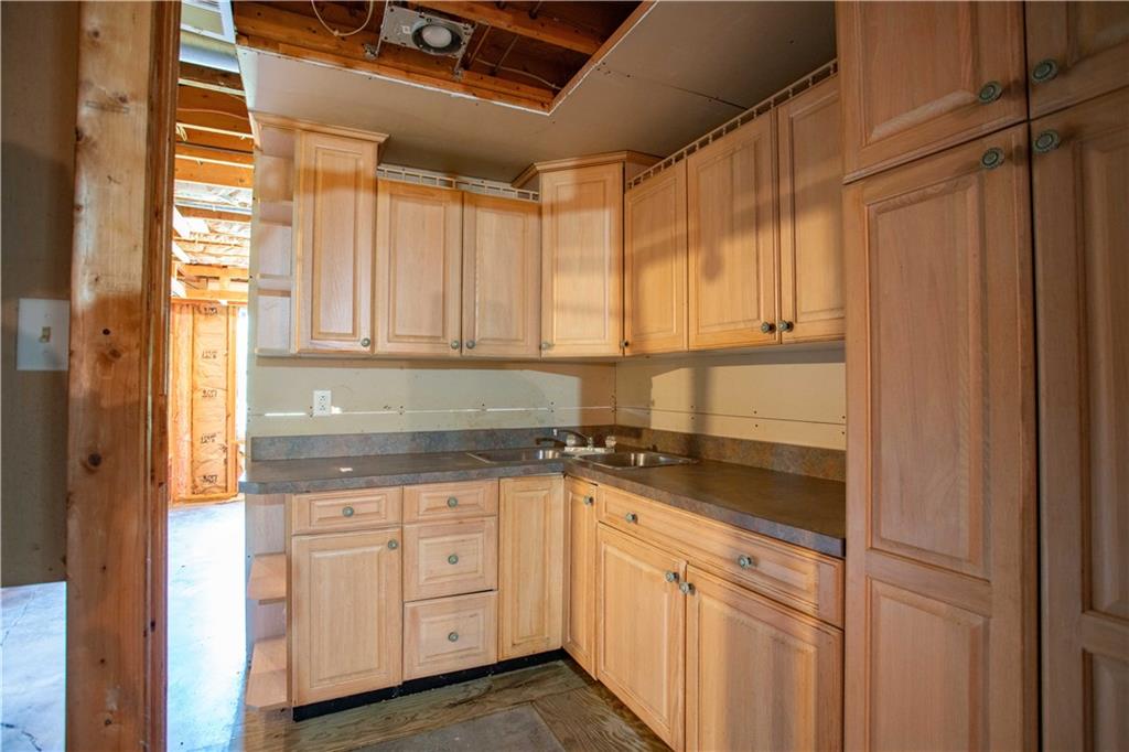 103 Mowry Road Monaca, PA 15061 - Photo 21 of 38 a kitchen with granite countertop cabinets stainless steel appliances and a window