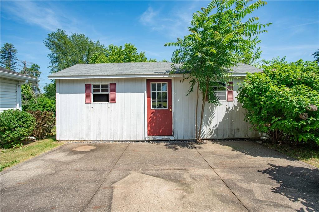 103 Mowry Road Monaca, PA 15061 - Photo 29 of 38 a view of backyard with potted plants and a large tree