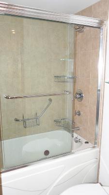 300 North State Street, Unit 2609 Chicago, IL 60654 - Photo 2 of 9 a bathroom with a shower and a bath tub