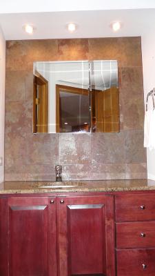 300 North State Street, Unit 2609 Chicago, IL 60654 - Photo 8 of 9 a bathroom with a sink and a large mirror