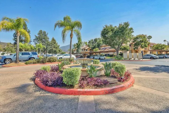 a view of a swimming pool with a yard