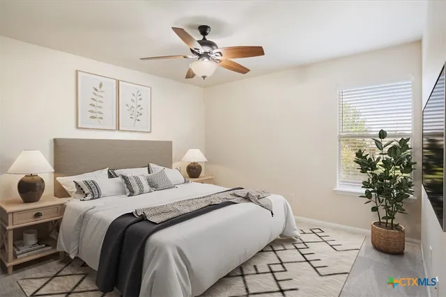 a bedroom with a bed and a window