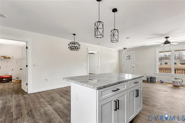 a kitchen with stainless steel appliances granite countertop a sink and cabinets
