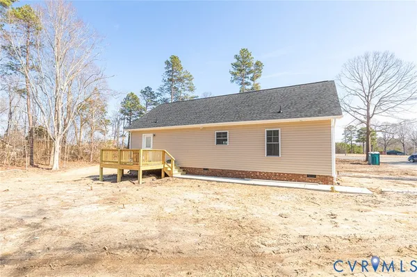 a view of a house with snow on the road