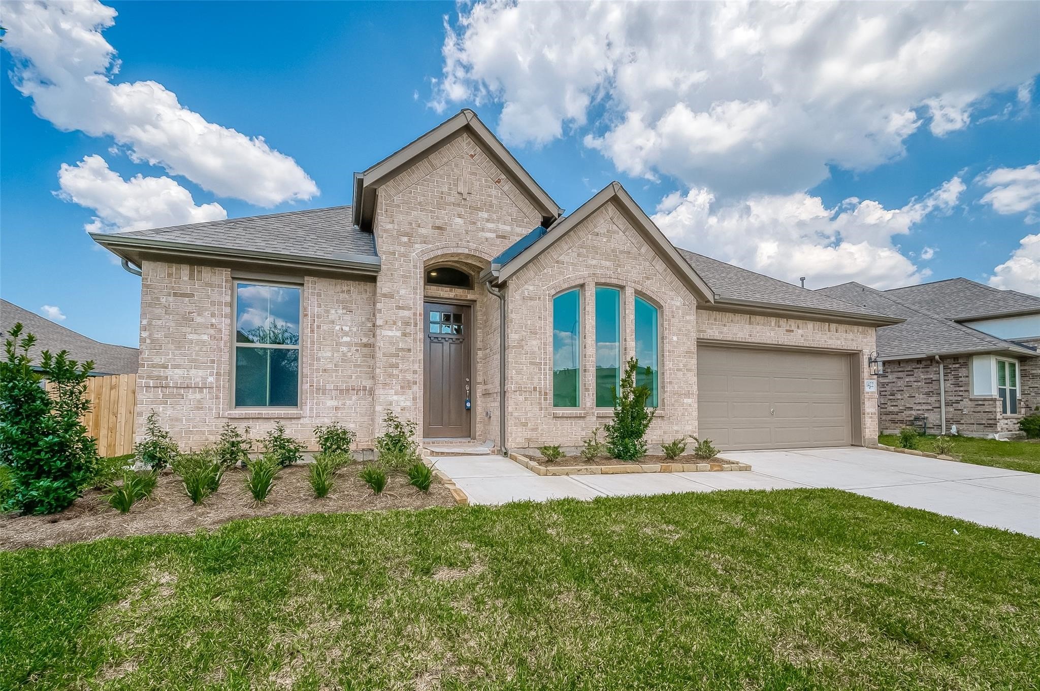 a front view of a house with garden