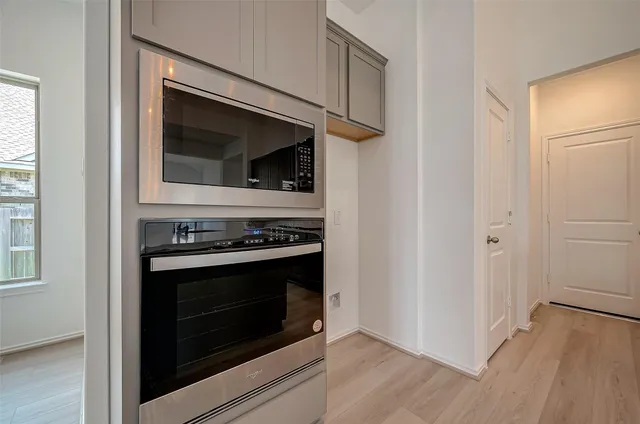 a kitchen with a stove and a microwave