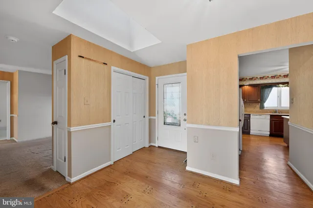 a view of a living room with wooden floor