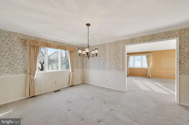 a view of a room with large windows