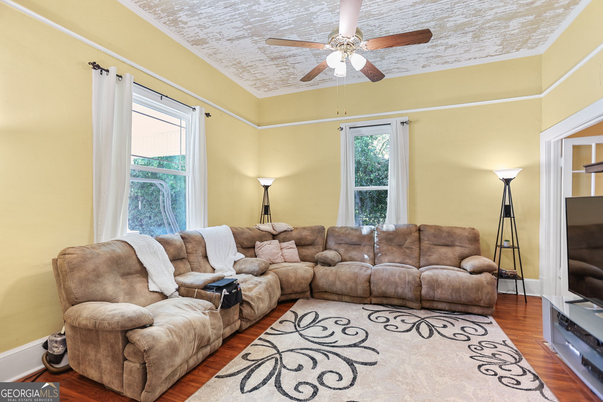 1205 Terrell Street Greenville, GA 30222 - Photo 8 of 50 a living room with furniture flat screen tv and a large window