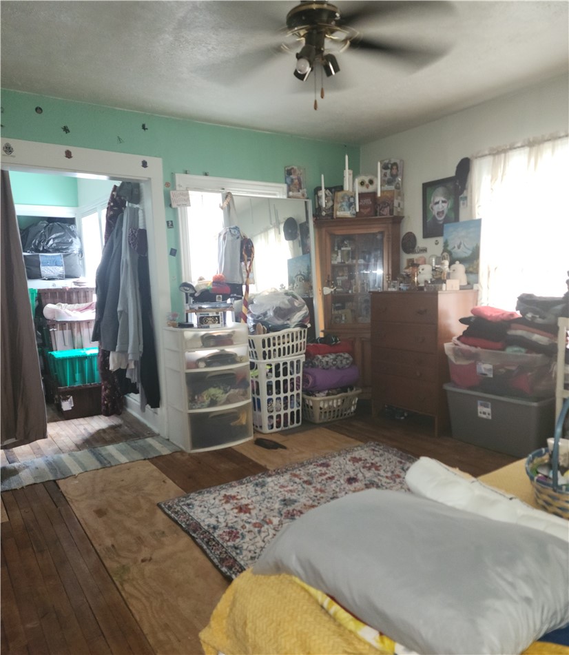 1436 Ruskin Road Dayton, OH 45406 - Photo 29 of 29 This cozy bedroom features a ceiling fan, providing comfort and style with a large closet.