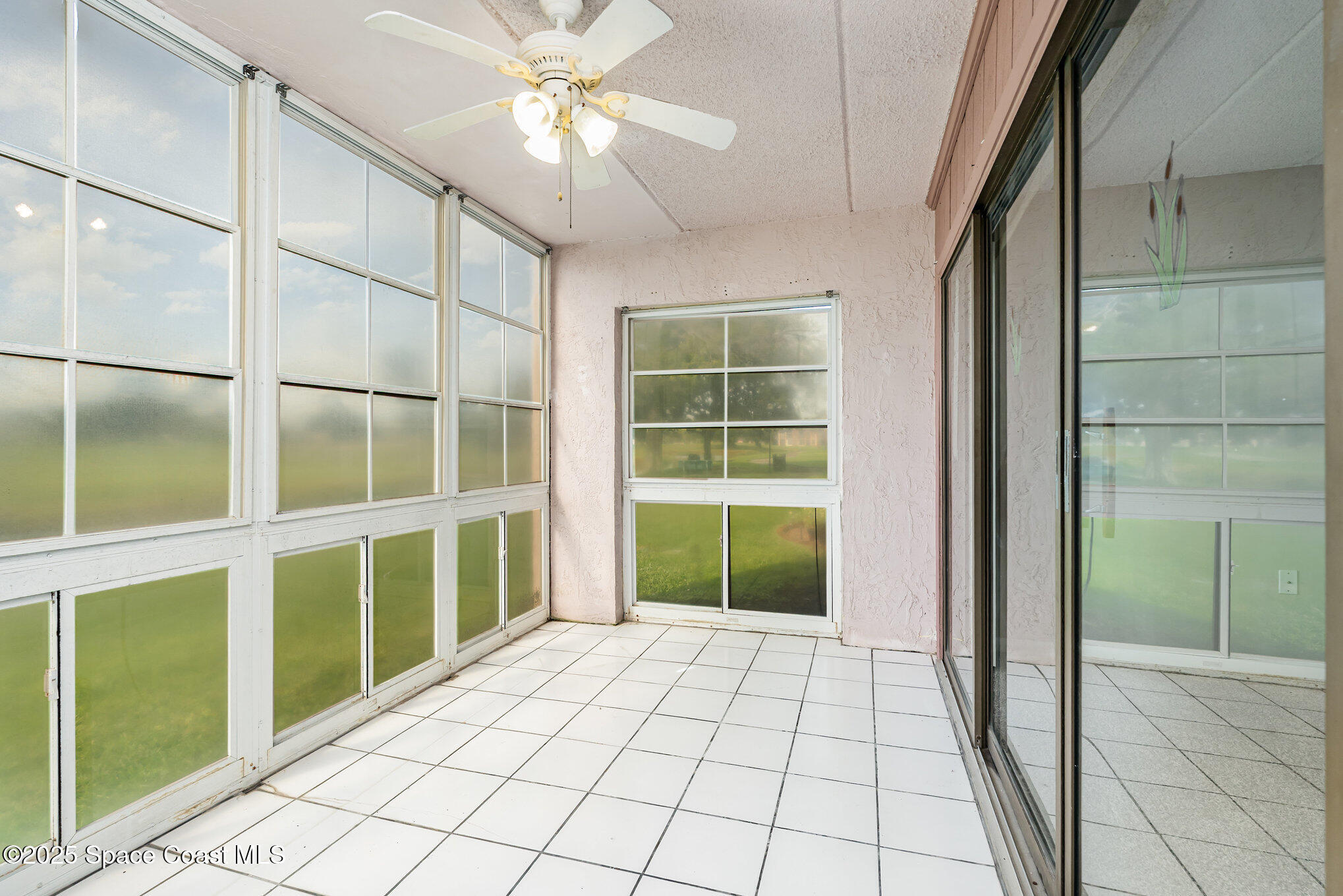 2727 North Wickham Road, Unit 10210 Melbourne, FL 32935 - Photo 19 of 35 a view of an empty room with a window
