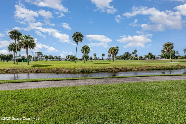 a view of a golf course with a house