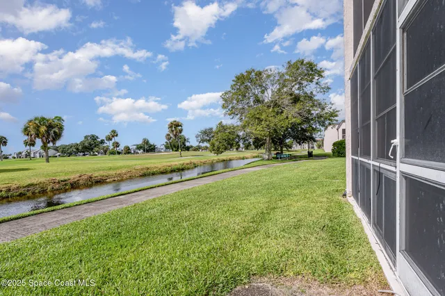 a view of a golf course with a lake