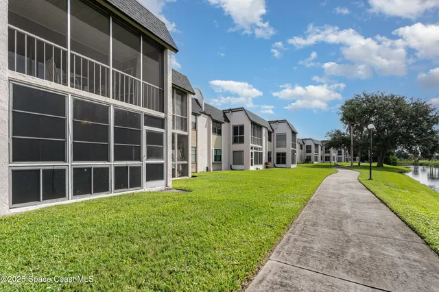 a view of an apartment with a garden