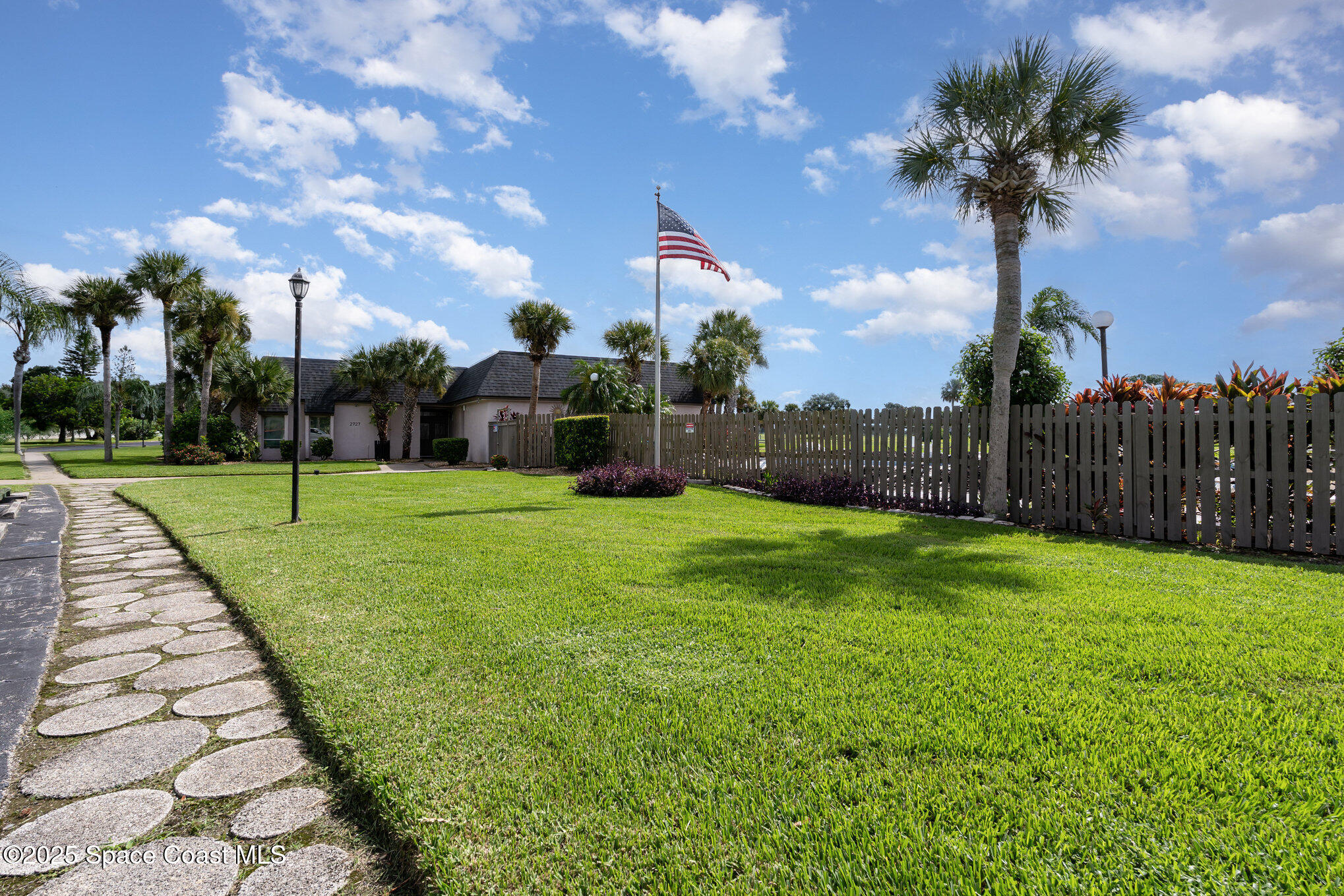 2727 North Wickham Road, Unit 10210 Melbourne, FL 32935 - Photo 30 of 35 a view of a garden with a slide