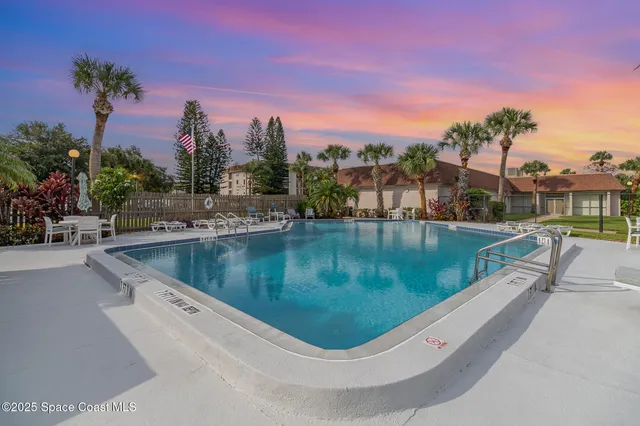 a view of a swimming pool with a terrace