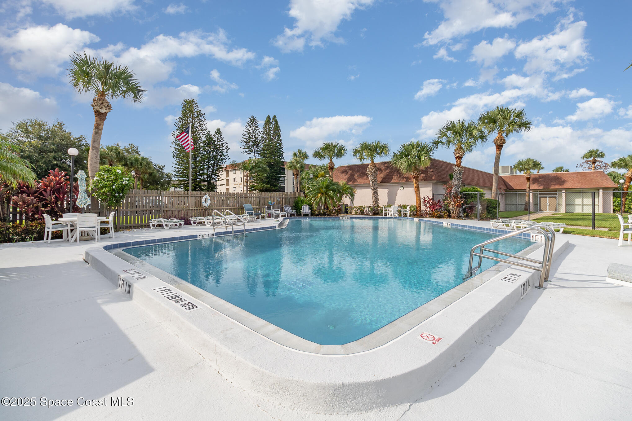 2727 North Wickham Road, Unit 10210 Melbourne, FL 32935 - Photo 34 of 35 a view of a swimming pool with outdoor seating