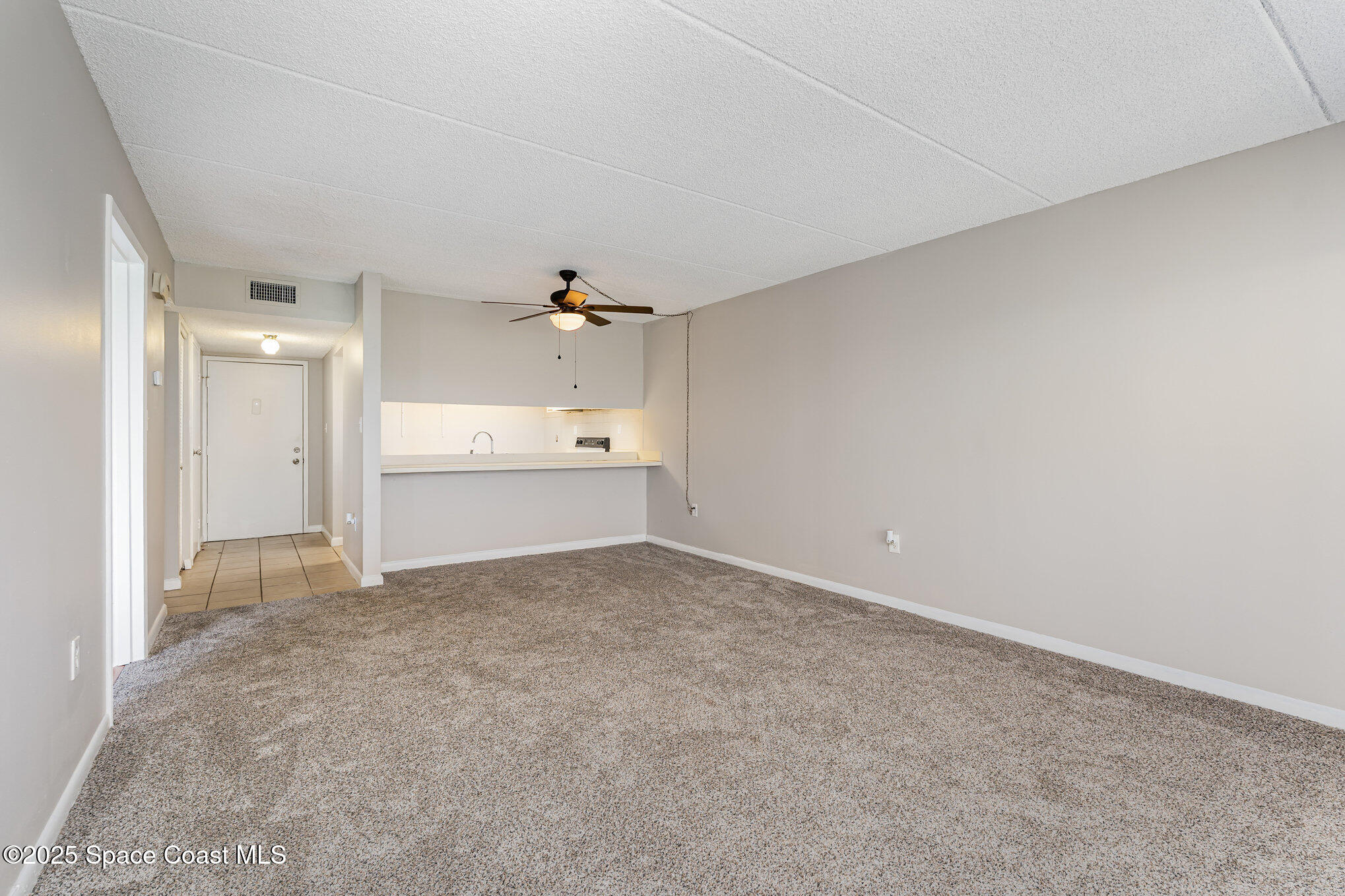 2727 North Wickham Road, Unit 10210 Melbourne, FL 32935 - Photo 6 of 35 a view of an empty room