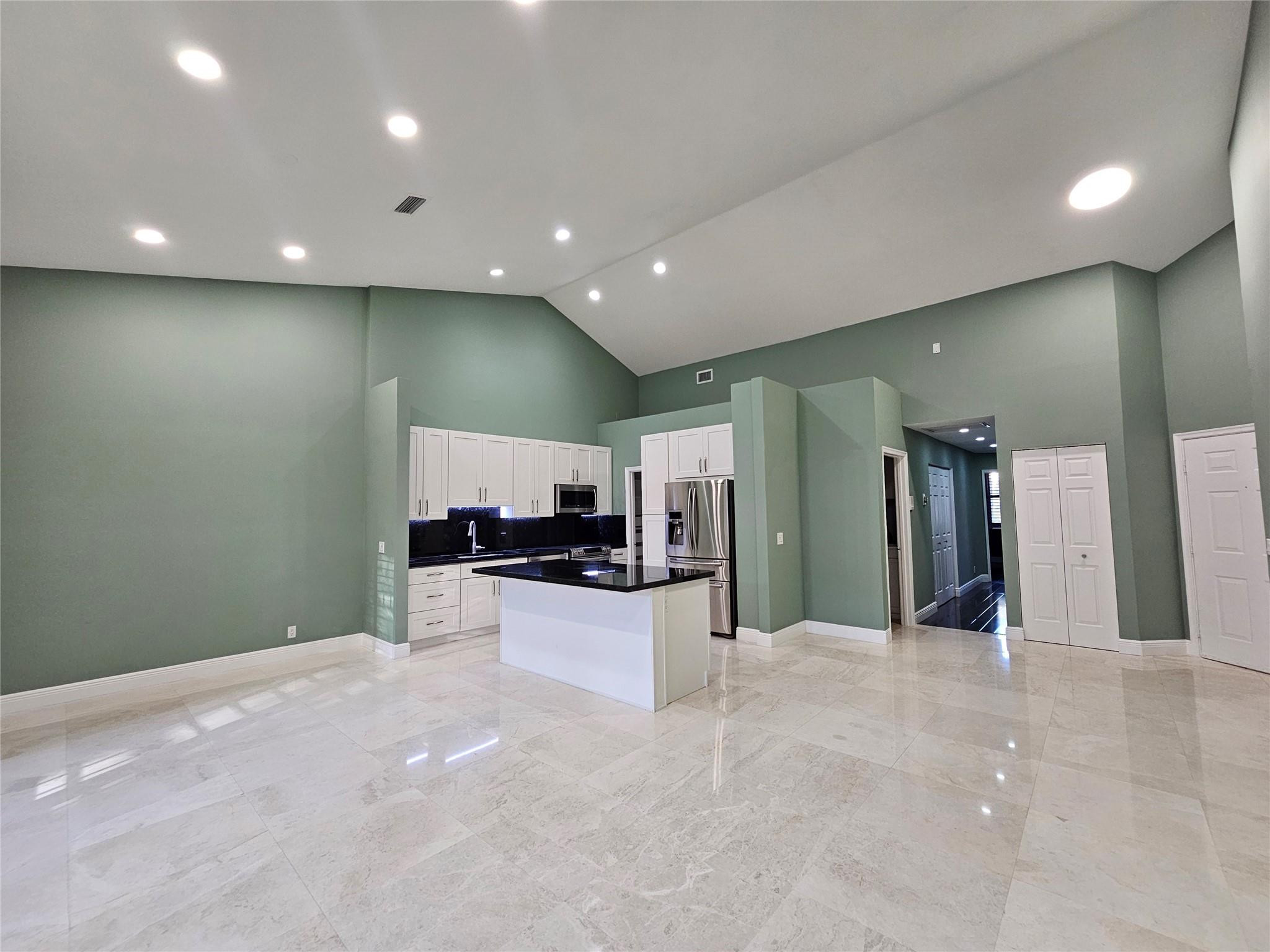 5770 Coach House Circle, Unit F Boca Raton, FL 33486 - Photo 5 of 21 Living Room/Dining Room/Kitchen