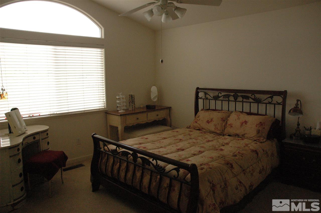 14661 Gold Run Drive Reno, NV 89521 - Photo 5 of 12 a bedroom with a bed and a window