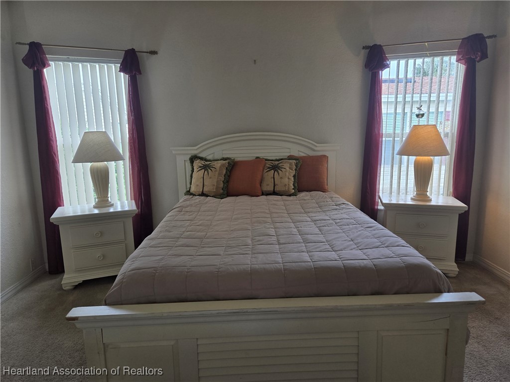 3312 Beartooth Pass Sebring, FL 33872 - Photo 22 of 39 a bedroom with a bed and a window