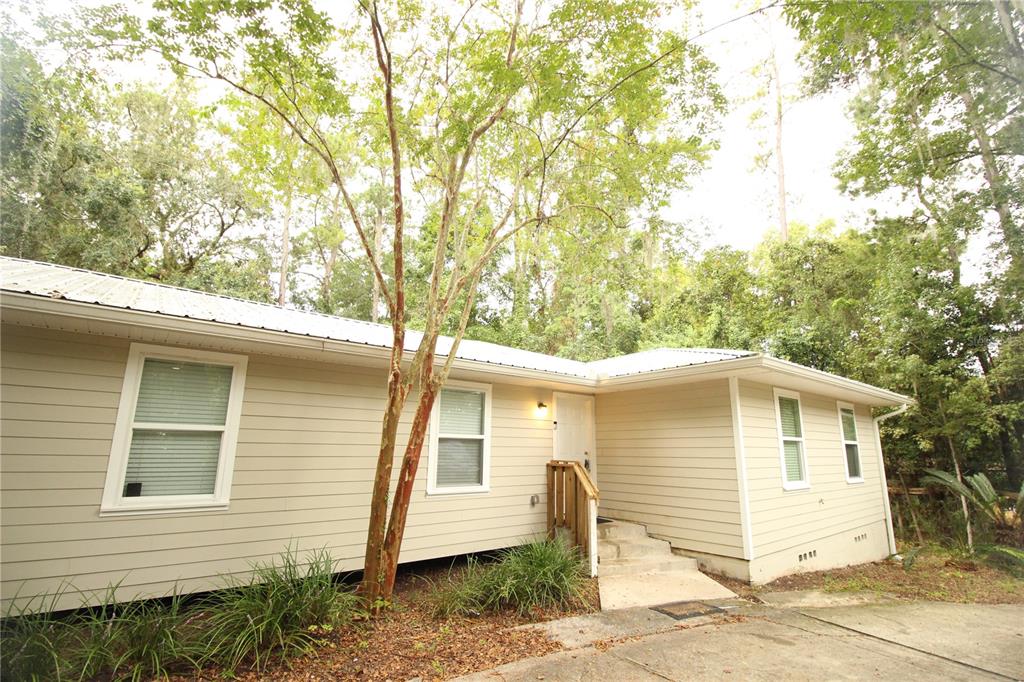 2929 West University Avenue Gainesville, FL 32607 - Photo 1 of 1 a front view of a house with a garage