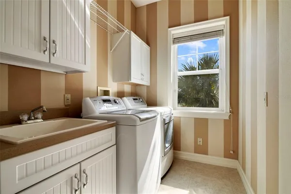 a view of a bathroom with dual sinks