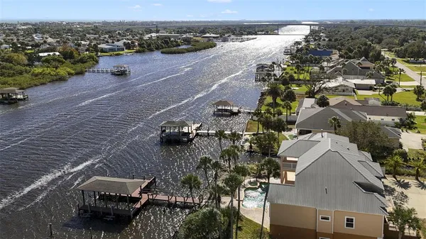 an aerial view of a house with outdoor space
