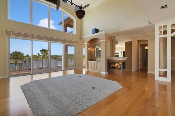 a view of a living room and a balcony