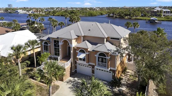 a front view of a house with garage