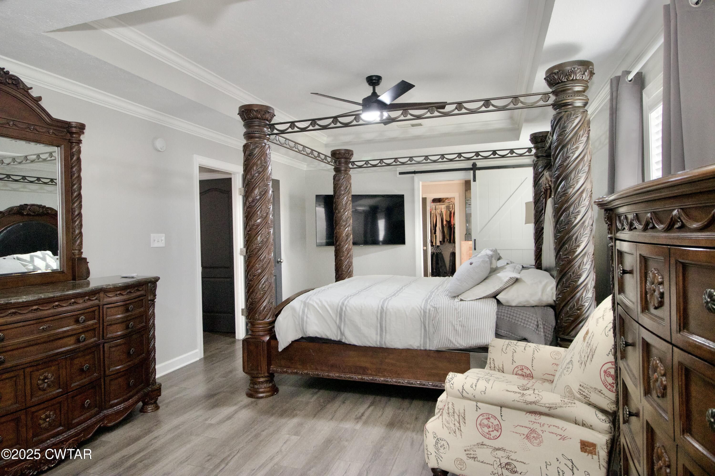 177 Fawn Ridge Lane Medina, TN 38355 - Photo 16 of 44 a bedroom with a bed and wooden floor