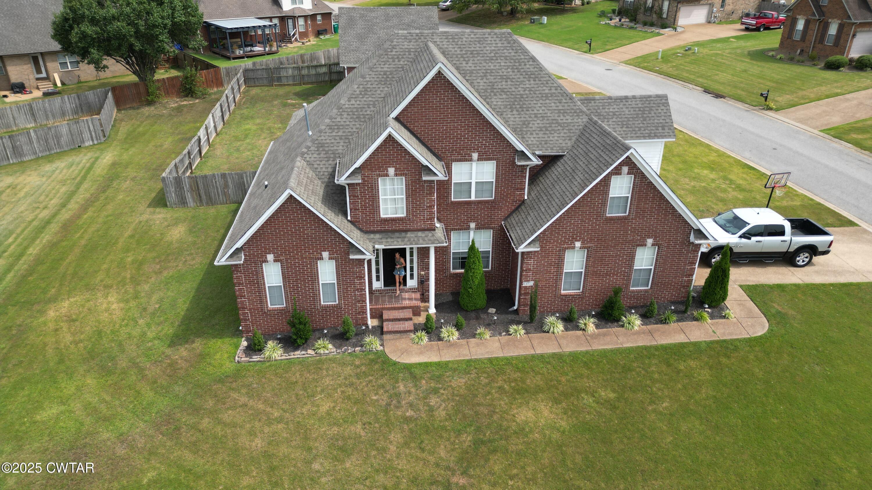 177 Fawn Ridge Lane Medina, TN 38355 - Photo 2 of 44 a front view of a house with a yard