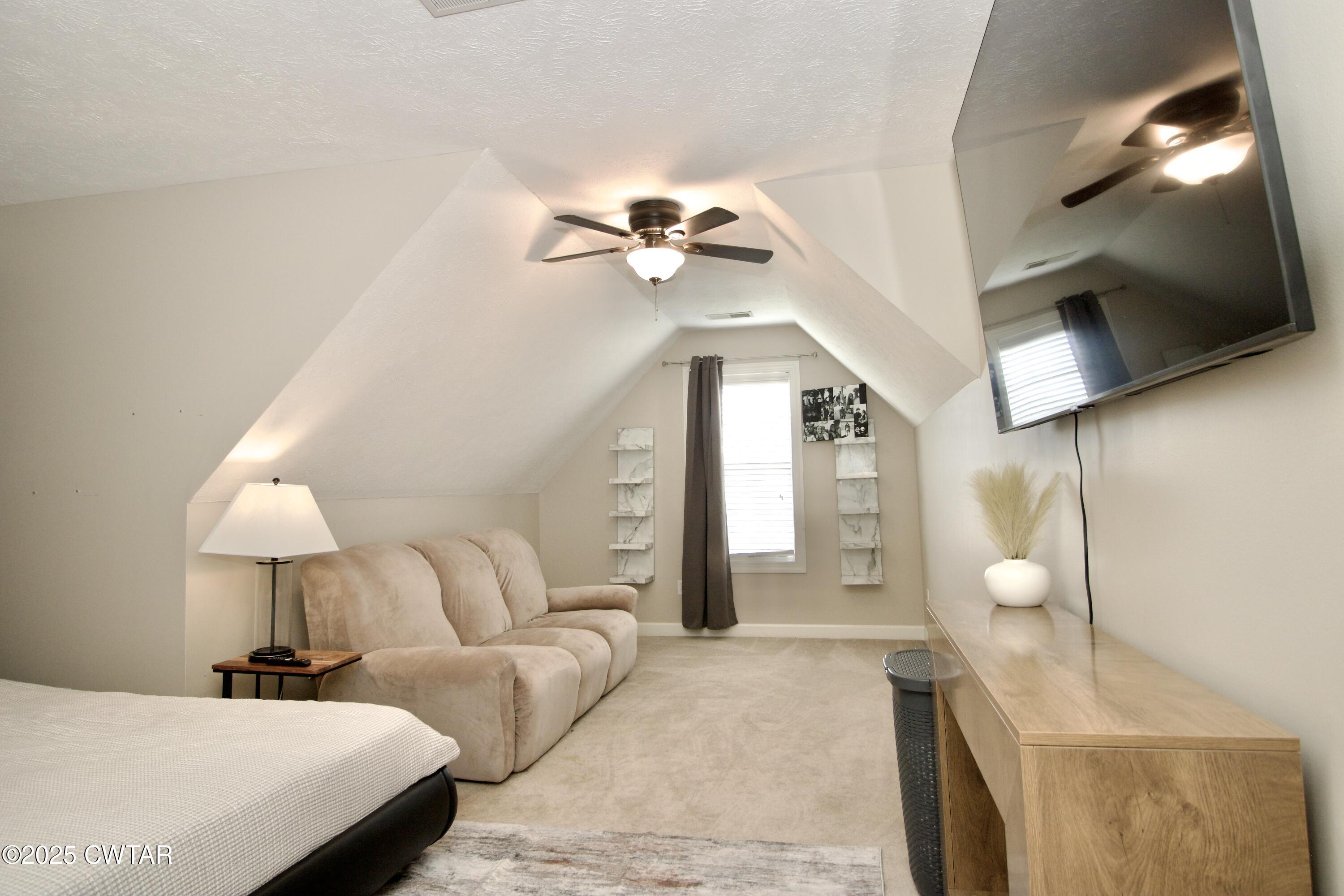 177 Fawn Ridge Lane Medina, TN 38355 - Photo 21 of 44 a bedroom with a bed and a lamp