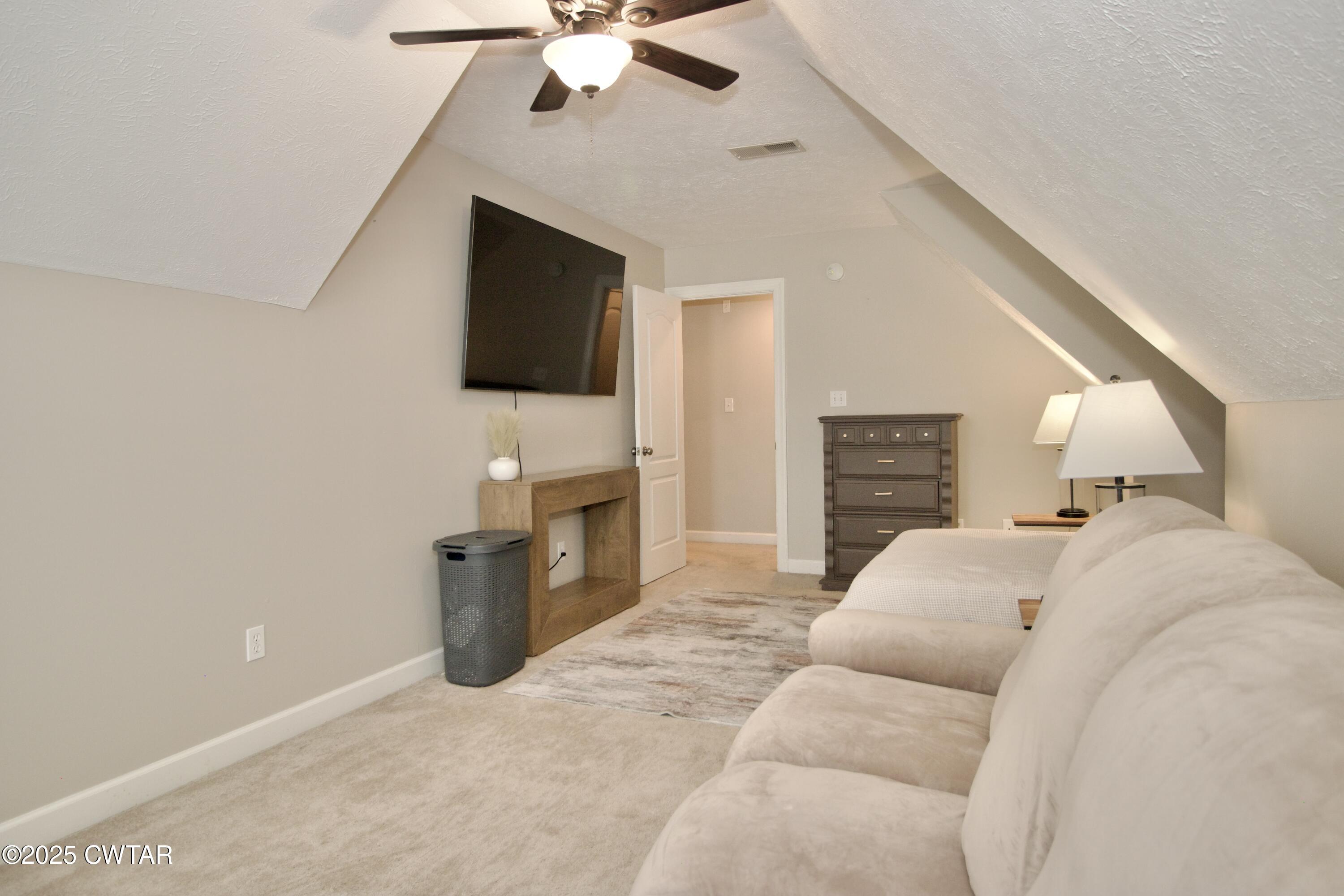 177 Fawn Ridge Lane Medina, TN 38355 - Photo 22 of 44 a living room with furniture and a flat screen tv