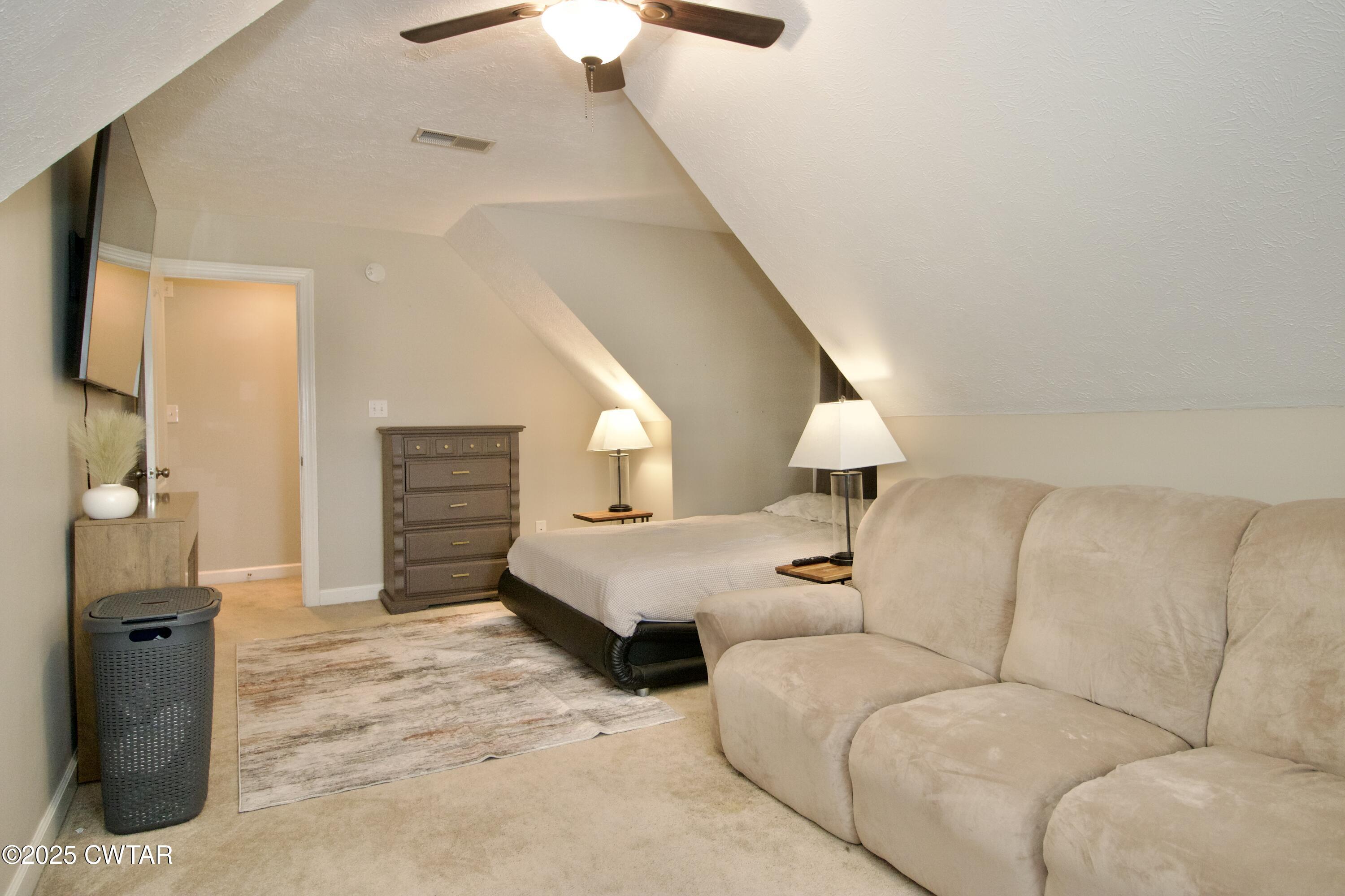 177 Fawn Ridge Lane Medina, TN 38355 - Photo 23 of 44 a bed room with a bed and a couch