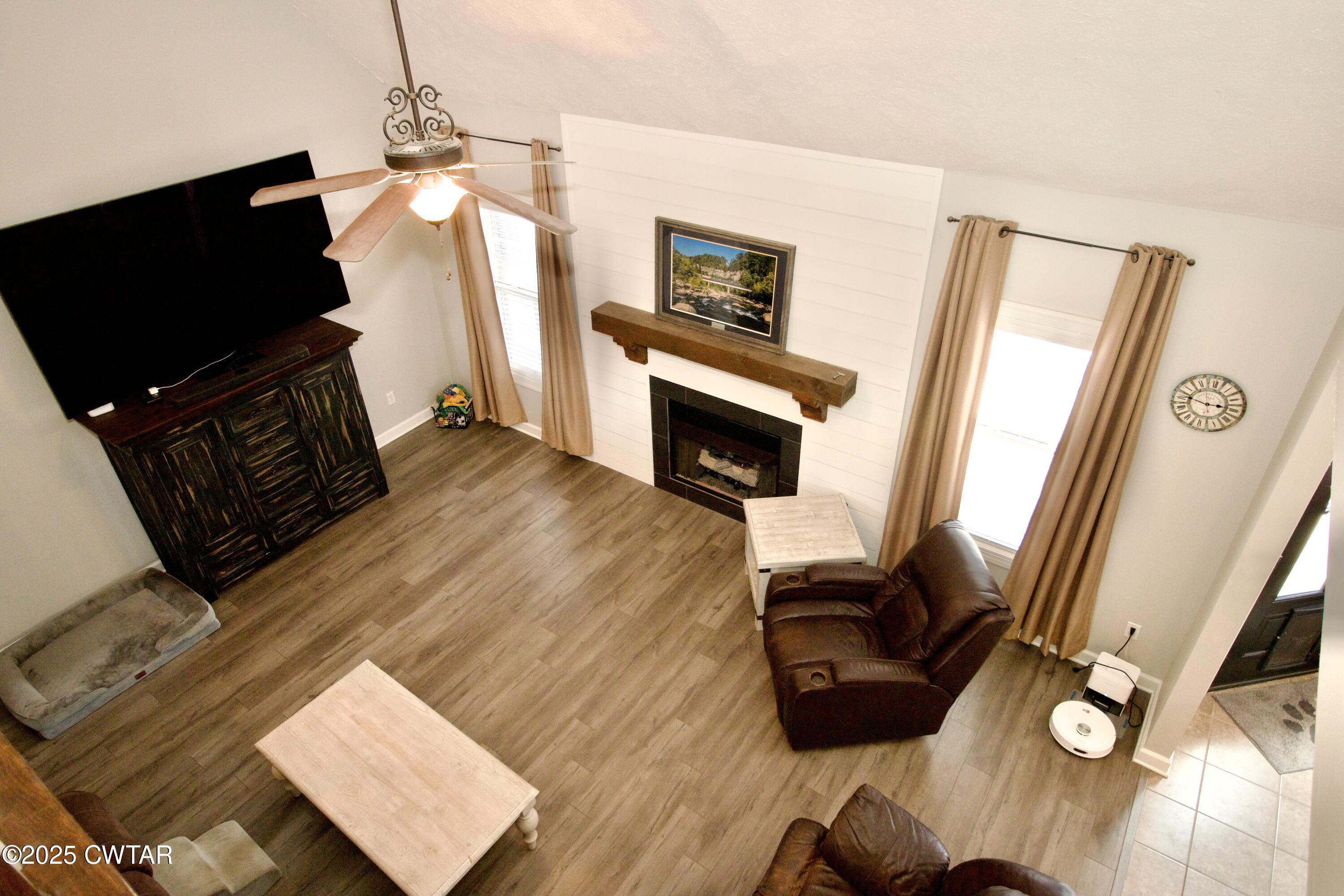 177 Fawn Ridge Lane Medina, TN 38355 - Photo 24 of 44 a living room with furniture and a flat screen tv