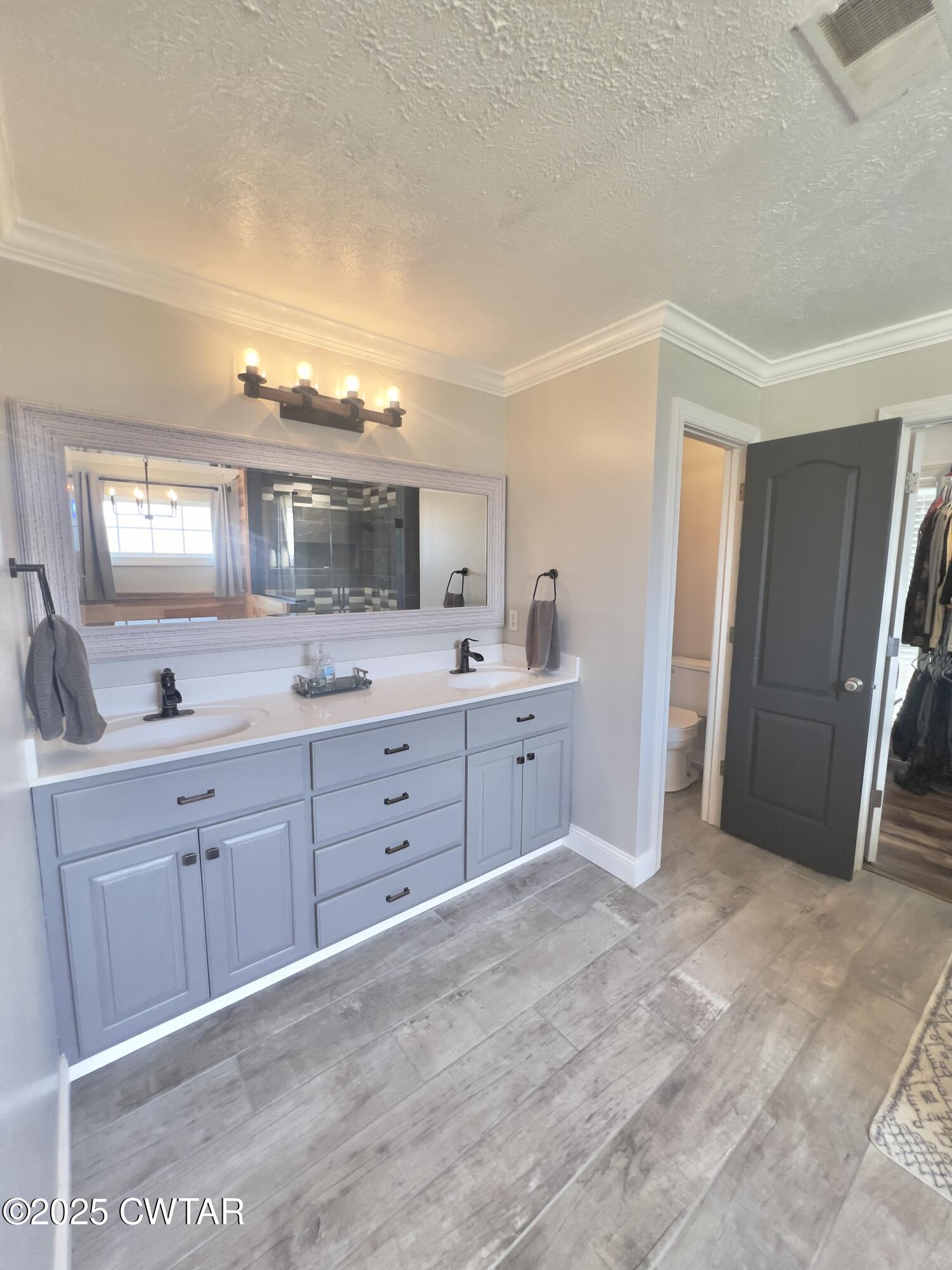 177 Fawn Ridge Lane Medina, TN 38355 - Photo 35 of 44 a spacious bathroom with a granite countertop sink mirror and cabinets