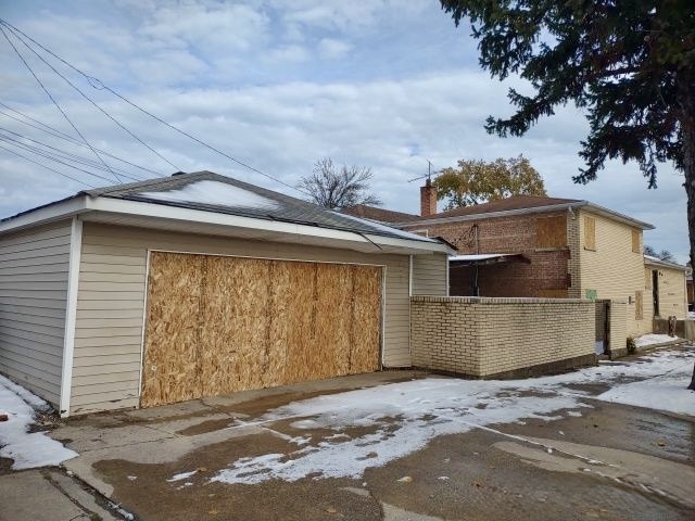 9356 South Oglesby Avenue Chicago, IL 60617 - Photo 4 of 12 a front view of a house with a garage