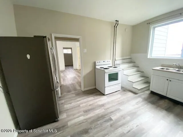 a view of a kitchen with a sink