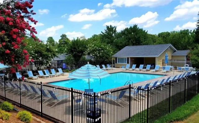 a view of a patio with furniture and a yard