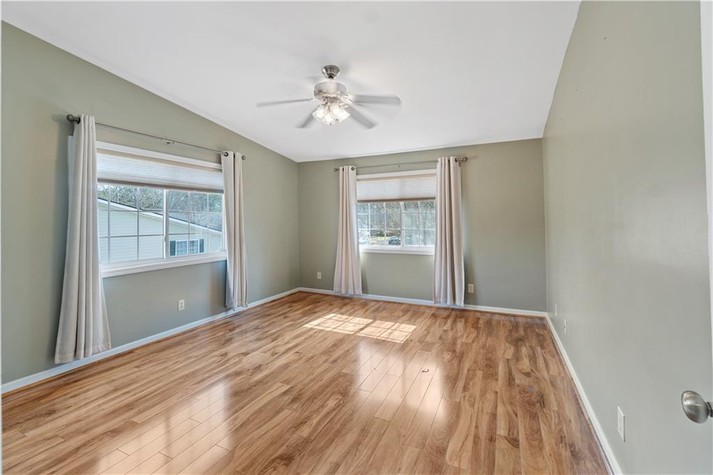 1468 Briarwood Road Northeast, Unit 1104 Atlanta, GA 30319 - Photo 14 of 15 a view of empty room with wooden floor and fan