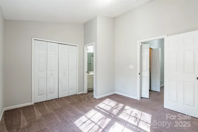 a view of a bedroom with closet area
