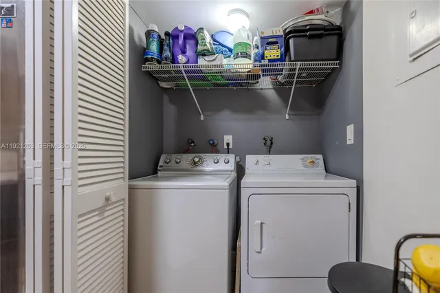 a utility room with dryer and washer